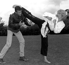 Celia Sisman kicking an attacker in the head